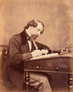 Photo of Dickens at his desk, 1858. Charles Dickens was working on The Mystery of Edwin Drood when he had a fatal stroke