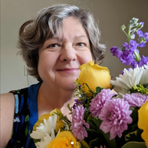 Karen Strickholm with get well flowers.