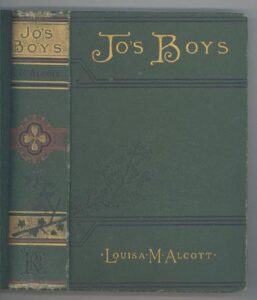 Color photo of green book with gold highlights. Cover and spine of 1887 edition of Jo's Boys. Cover and spine of 1887 edition of w:Jo's Boys